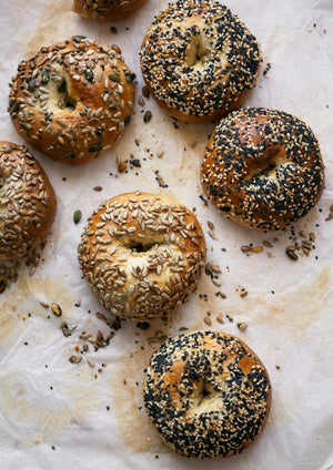 Everything and sesame bagels on parchment