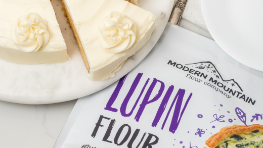 A pouch of Modern Mountain Lupin Flour next to Keto Vanilla or Keto Yellow Cake