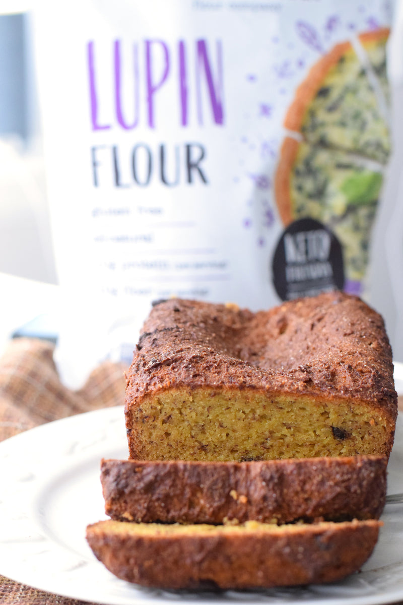 Modern Mountain Lupin Flour pouch beside sliced banana bread
