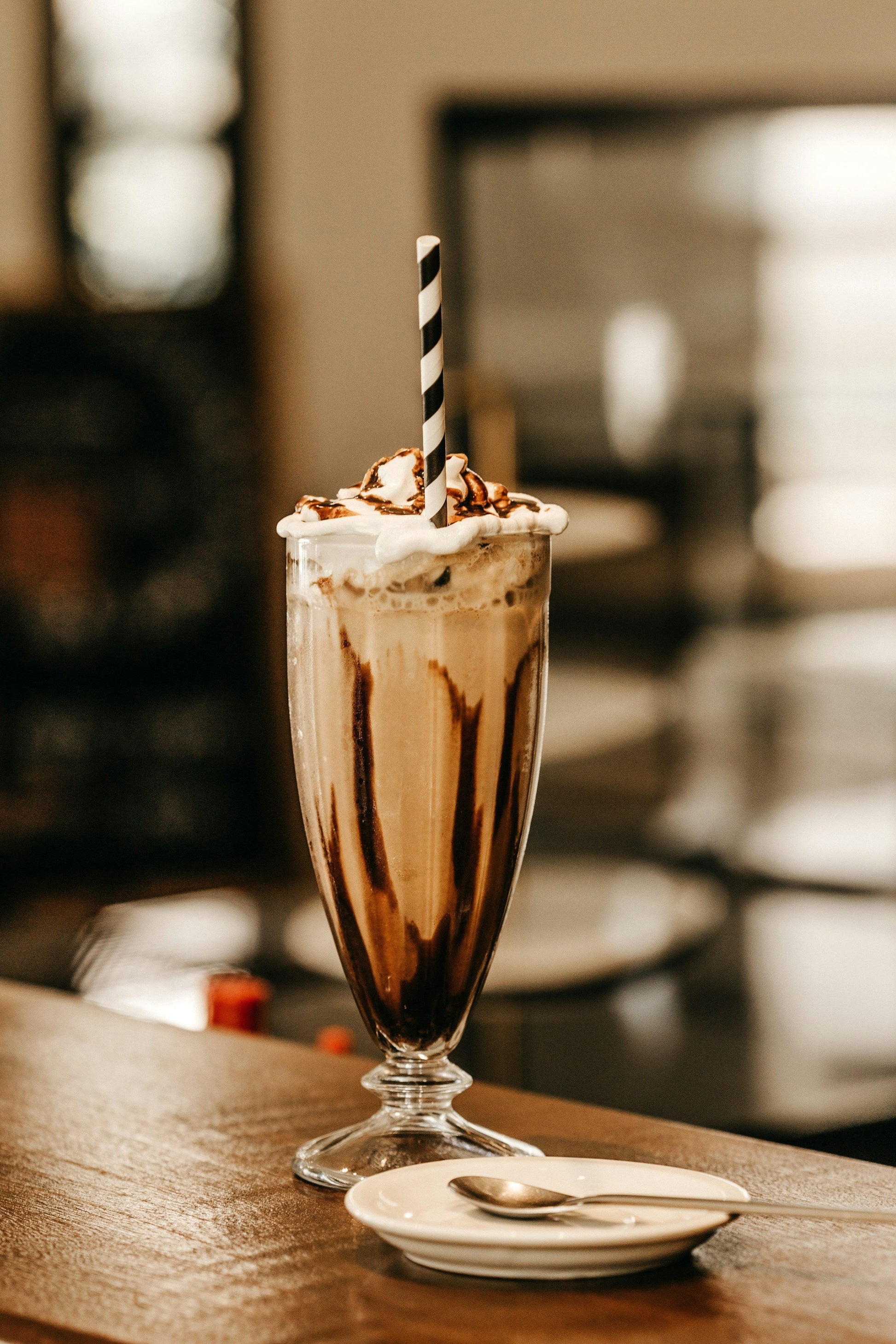 Vanilla malted milkshake topped with whipped cream