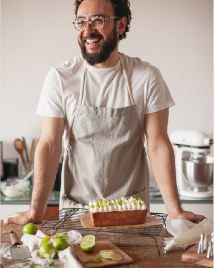 Baker holding a loaf of bread